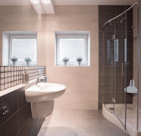 bathroom with sink, window and shower step
