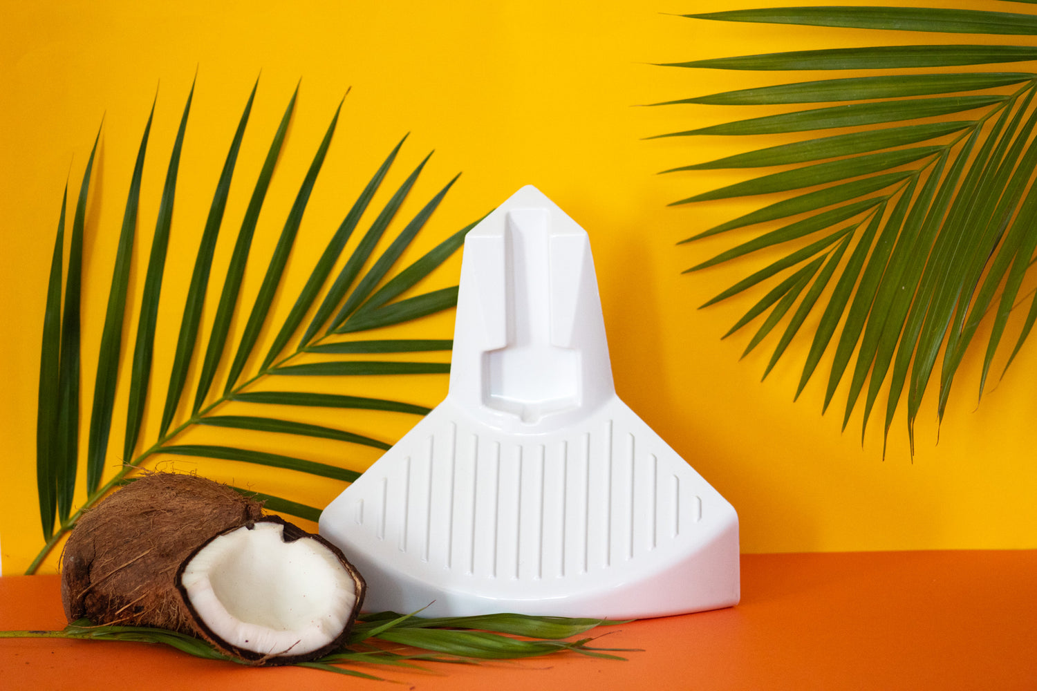 ElevEase shower step against a tropical orange backdrop