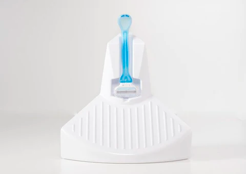 Close up of ElevEase shower step with blue razor