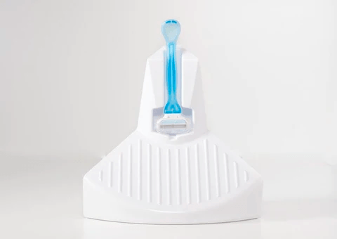 Close up of ElevEase shower step with blue razor